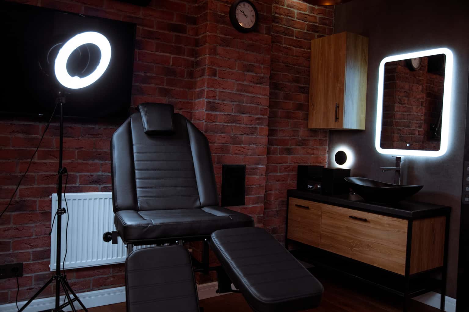 Modern Tattoo Studio set against a Backdrop of Exposed Brick Walls | selftattoo.com