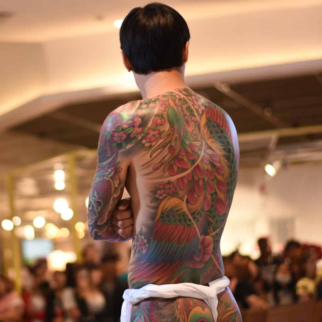 Vibrant Traditional Japanese Phoenix Body Tattoo | selftattoo.com