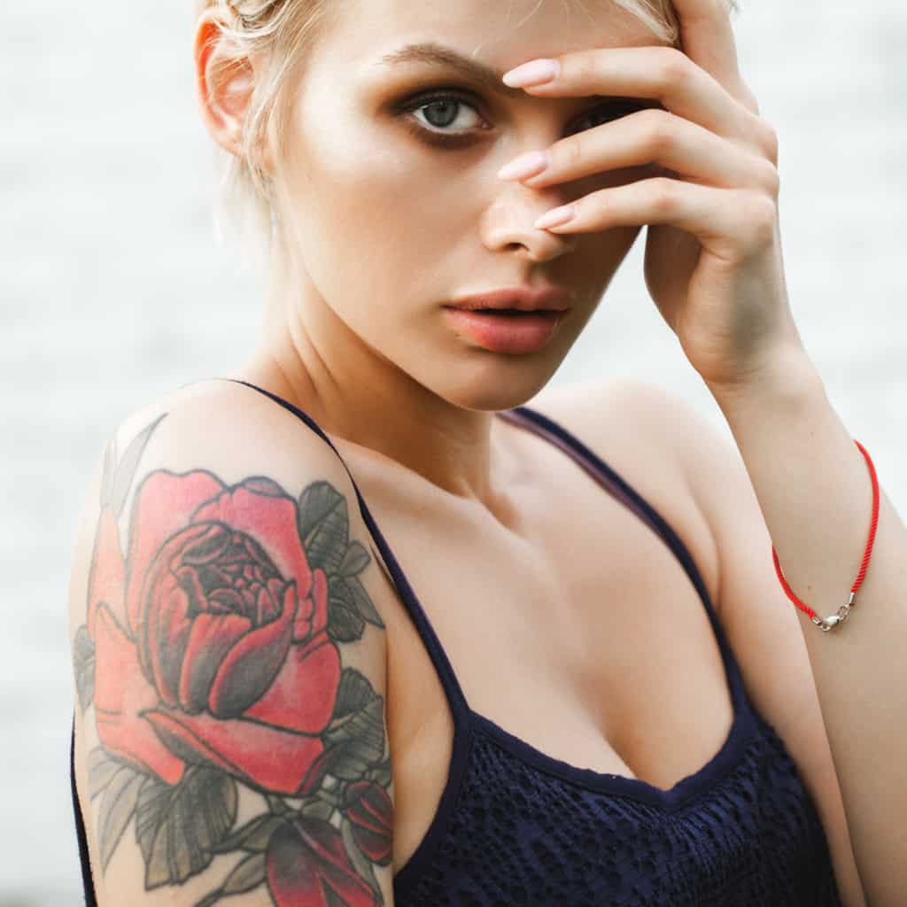 Large Bold Vibrant Red Rose with Dark Green Leaves Shoulder Tattoo | selftattoo.com