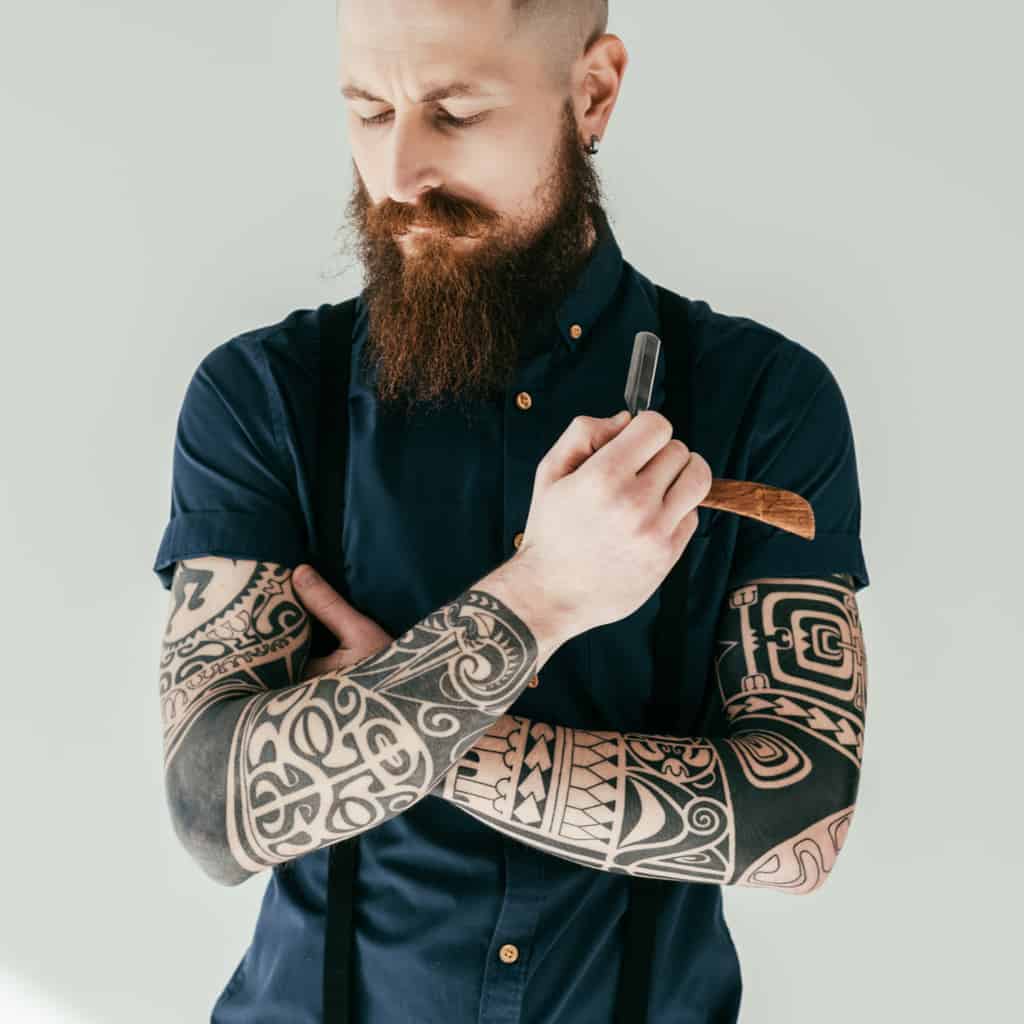 Bold Solid Black Ink with Tribal Patterns Arm Sleeve Tattoos | selftattoo.com