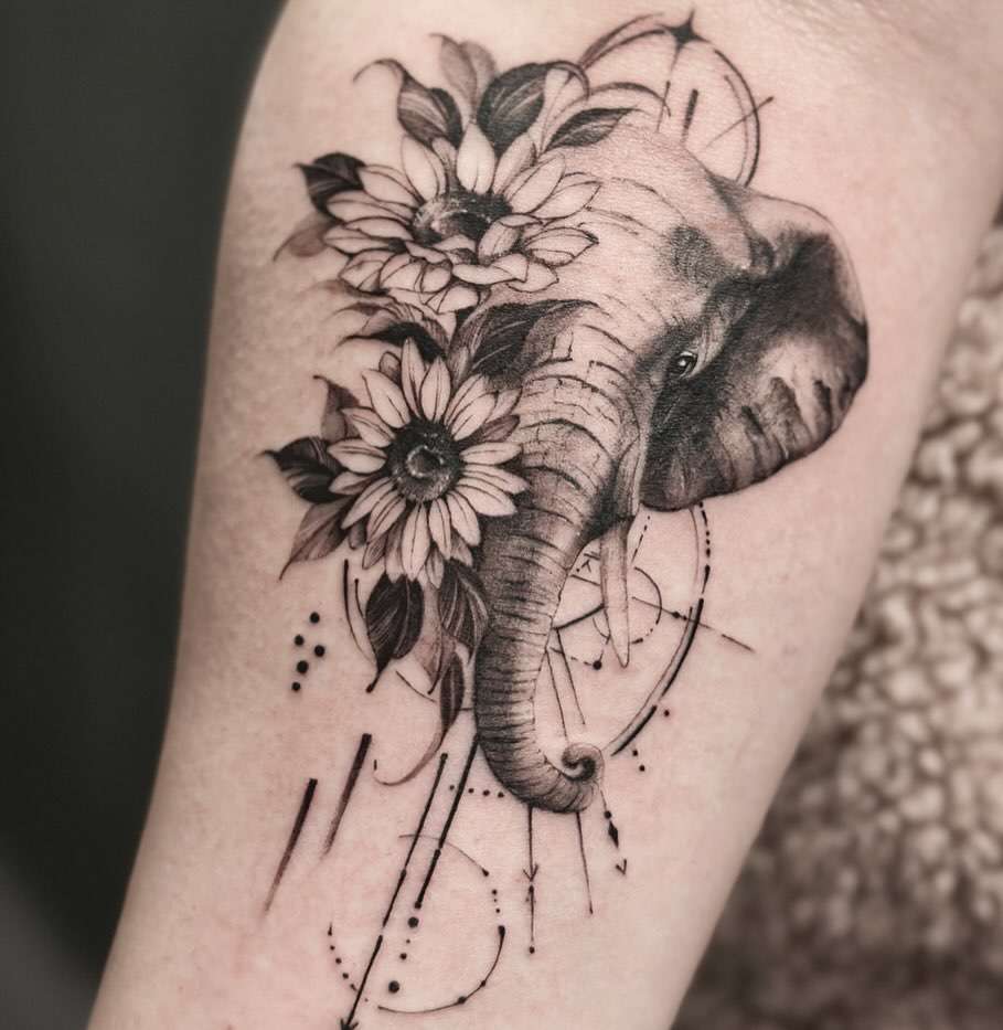 Realistic Black and Gray Elephant Tattoo with Large Sunflowers surrounded by Lines/Curves | selftattoo.com