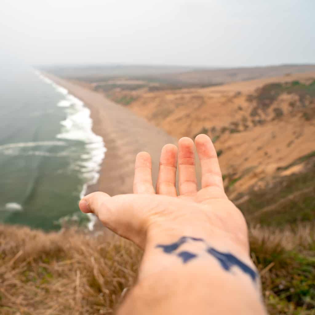 Simple Minimalist Solid Black Silhouette World Map Inner Wrist Tattoo | selftattoo.com