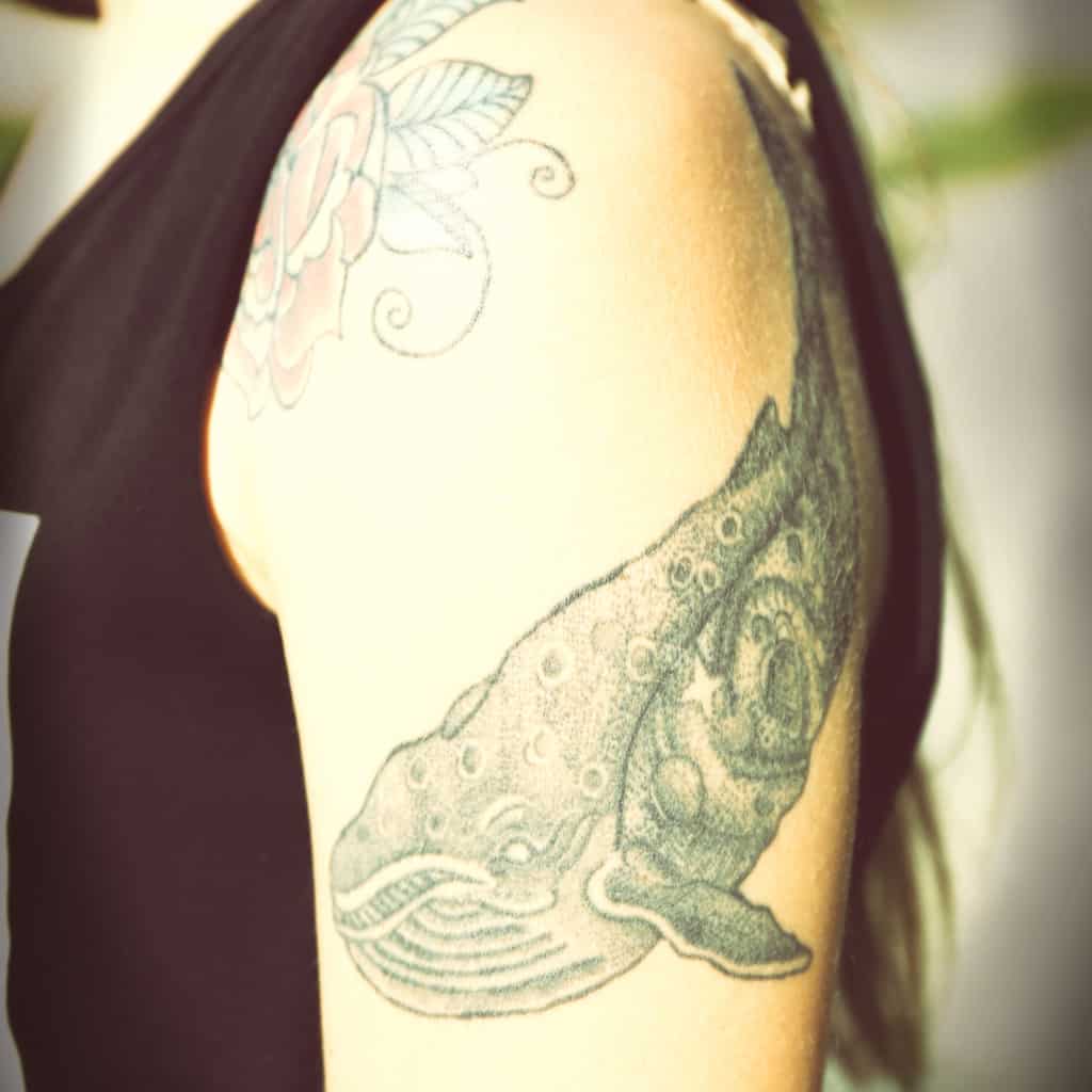 Bold Black and Gray Humpback Whale Upper Arm Tattoo | selftattoo.com