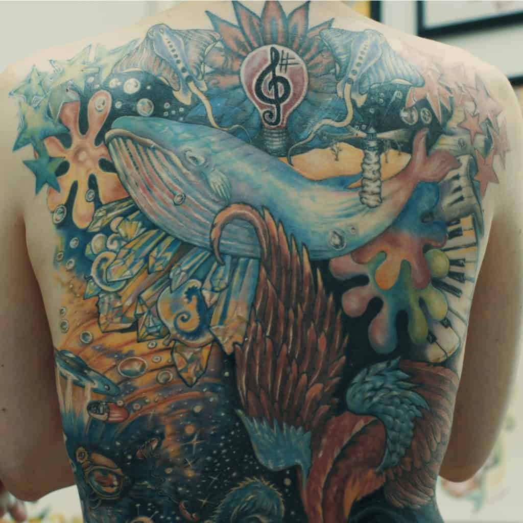 Colorful Surrealism Style Full Back Tattoo featuring Flying Animals and Objects in Outer Space | selftattoo.com