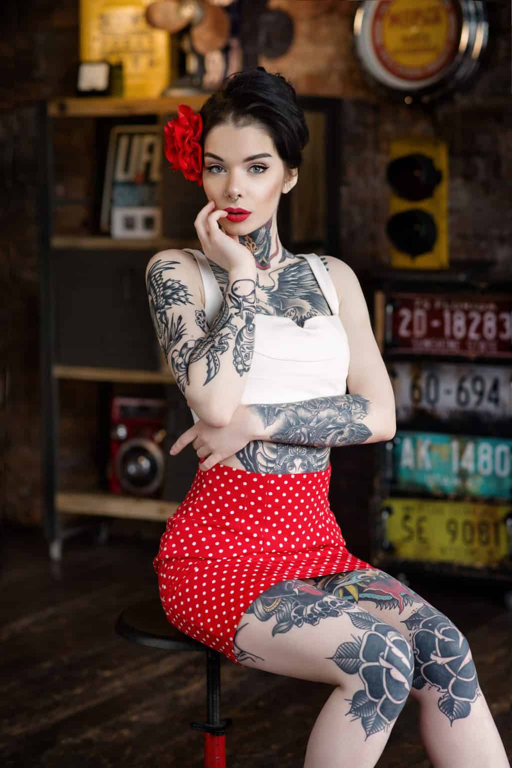 Woman in a Classic Pin-Up Style Appearance covered in American Traditional Style Full Body Tattoo | selftattoo.com