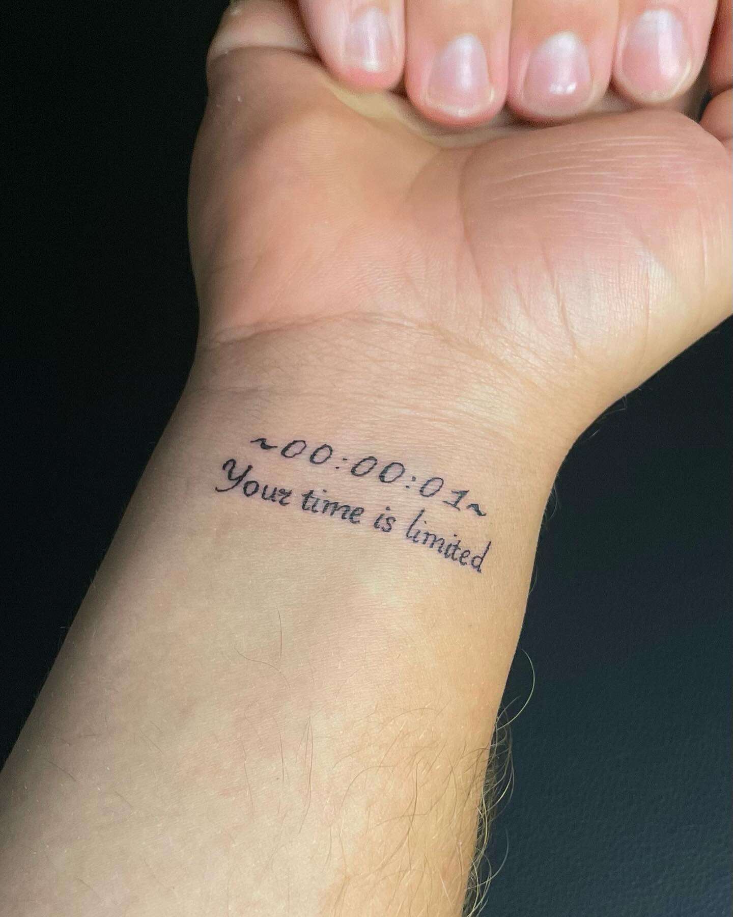 Simple Timer Style Text "00:00:01" Followed by "Your Time Is Limited" Wrist Tattoo | selftattoo.com