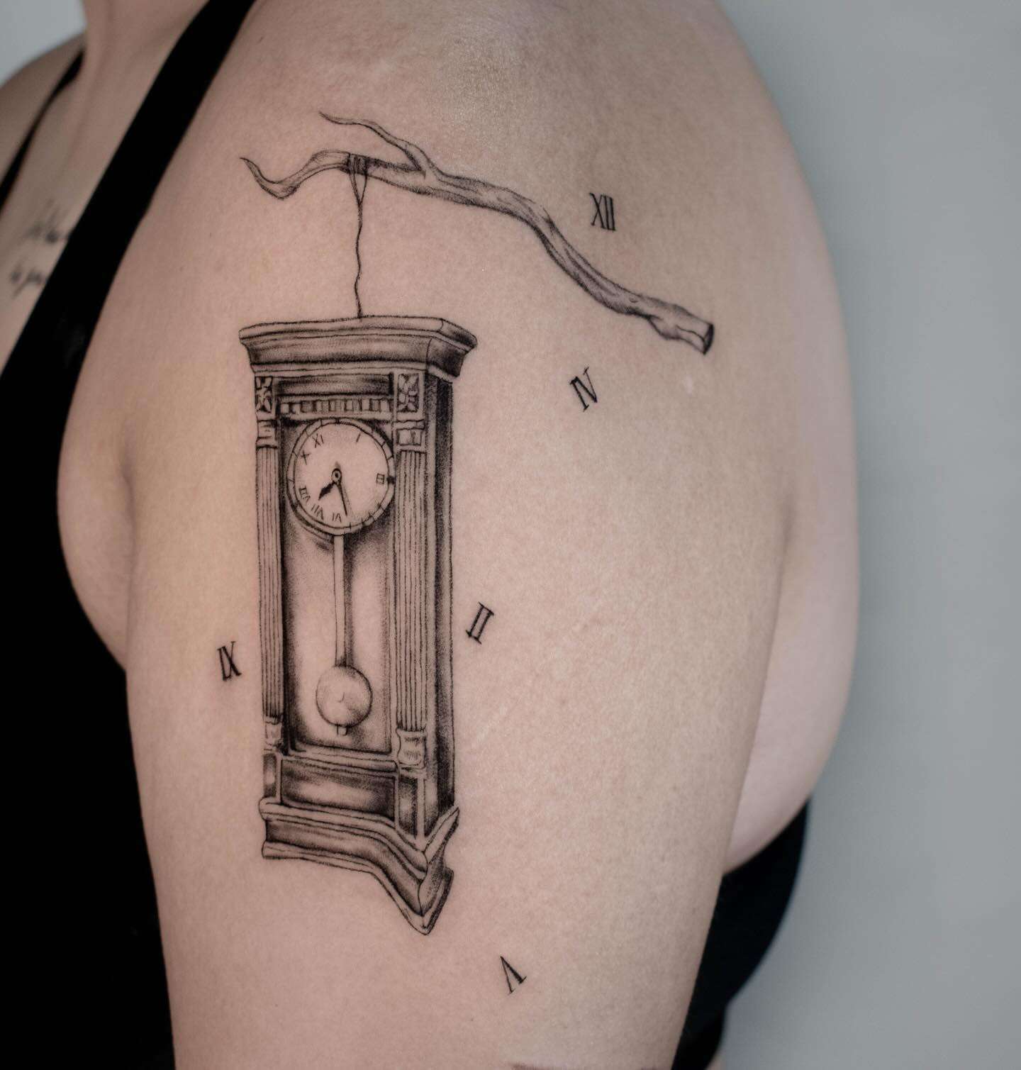 Realistic Fine Line Grandfather Clock Tattoo hanging from a Branch | selftattoo.com