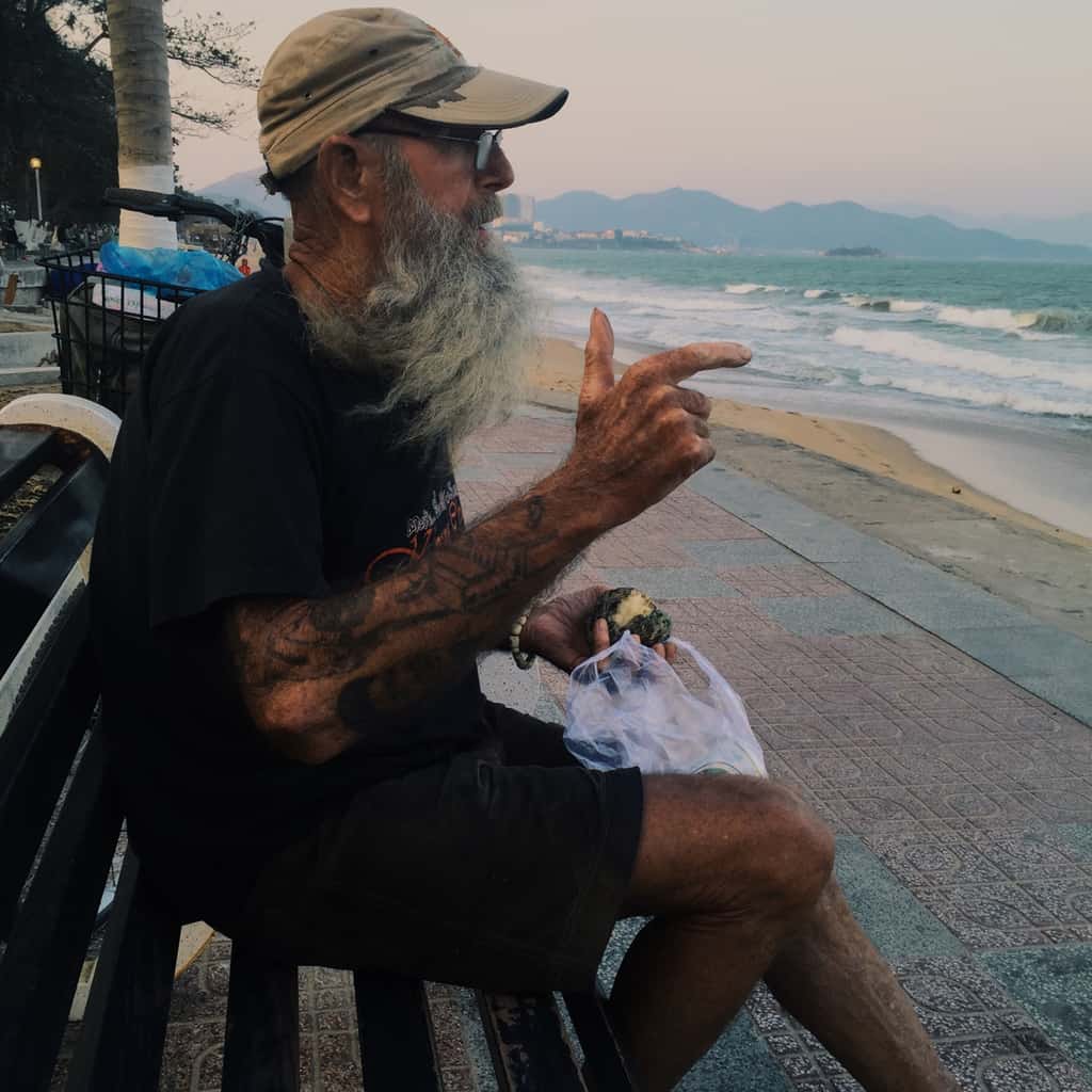 Old Man in a Rugged Appearance with a Bold Black Linework Forearm Tattoo | selftattoo.com