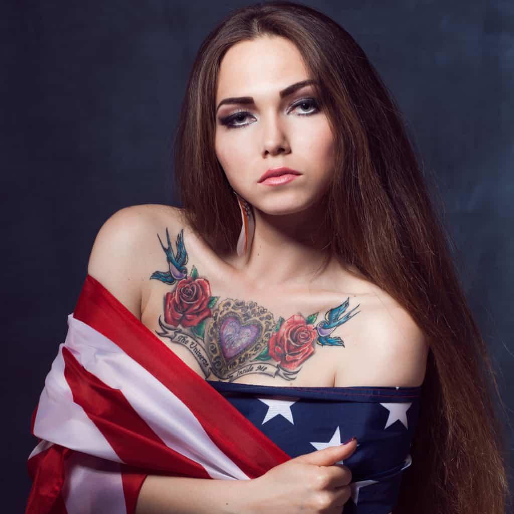 Realistic Ornamental Purple Heart Upper Chest Tattoo with Red Roses and Swallows on Either Side | selftattoo.com