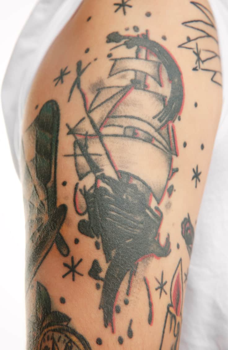 Bold and Dark American Traditional Ship Tattoo with Sketch Style Lines surrounded by Dots and Stars | selftattoo.com