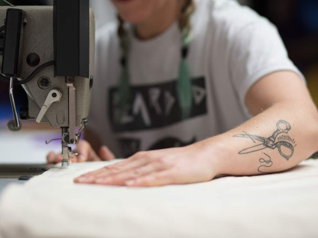 Finely Detailed Black Linework of a Pair of Open Scissors Forearm Tattoo | selftattoo.com