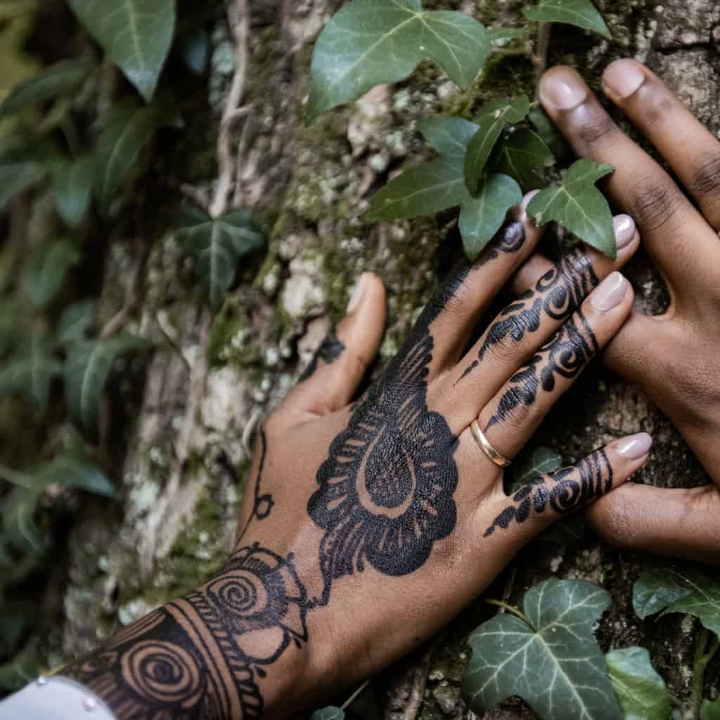 Thick Bold Black Paisley Motif surrounded by Swirling Patterns Hand Jagua Tattoo | selftattoo.com