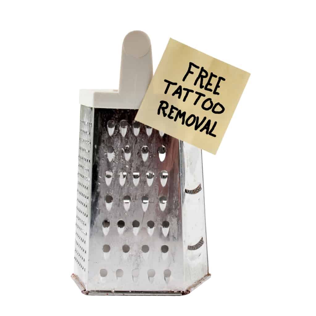 Cheese Grater with a Sticky Note that Reads "FREE TATTOO REMOVAL" | selftattoo.com