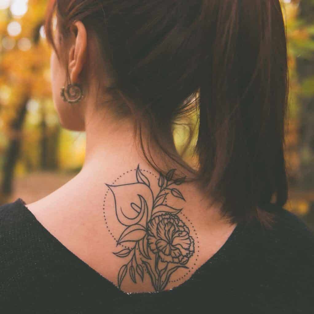 Clean and Precise Minimalistic Outlines of Flowers and Leaves Upper Back Tattoo | selftattoo.com