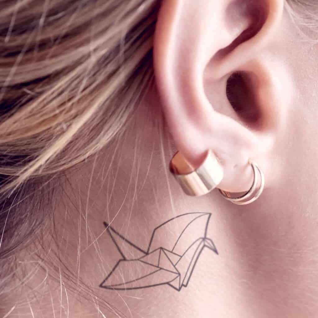 Minimalist Origami Crane Behind the Ear Tattoo | selftattoo.com