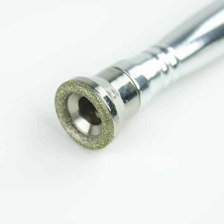 Close-up of a Dermabrasion Tool with a Cylindrical Silver Body | selftattoo.com