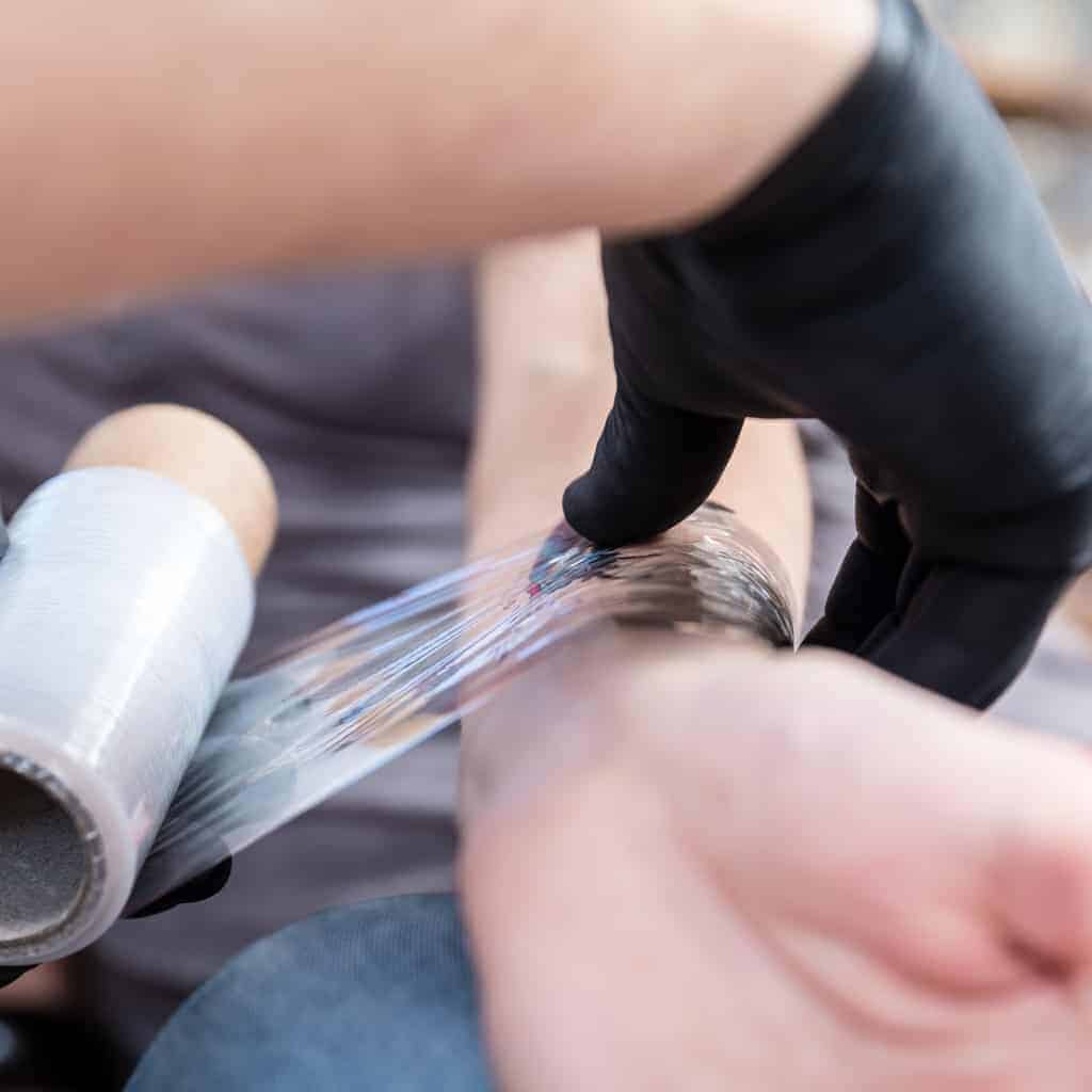 Tattoo being Wrapped in Protective Plastic Film | selftattoo.com