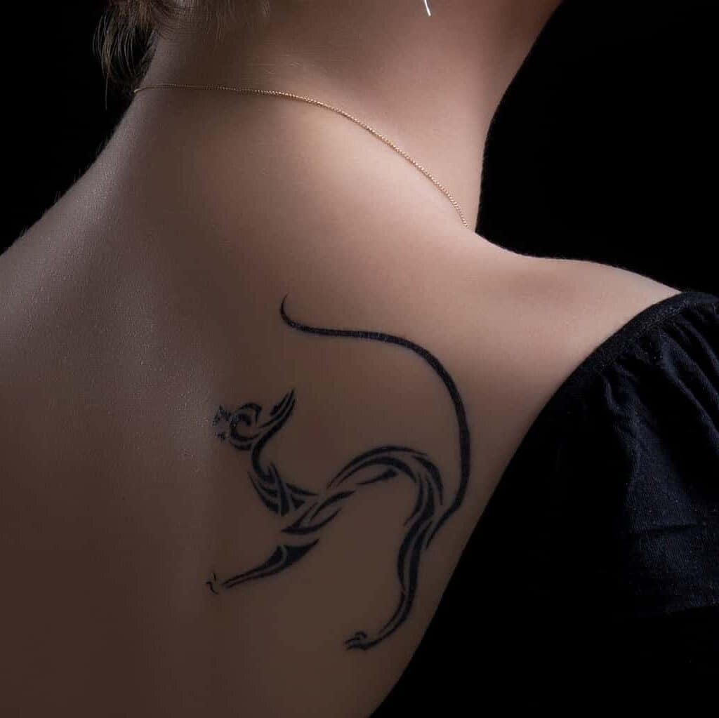 Bold Minimalistic Cat Tattoo with Sweeping Lines and Patterns | selftattoo.com