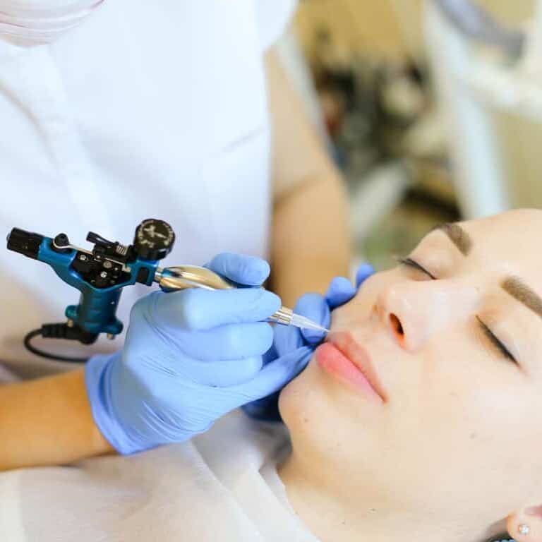 Lip Blushing Cosmetic Procedure being performed on a Woman's Lips | selftattoo.com