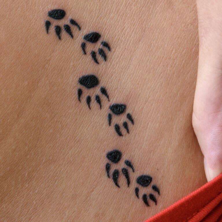 Trail of Small Black Paw Prints Tattoo | selftattoo.com