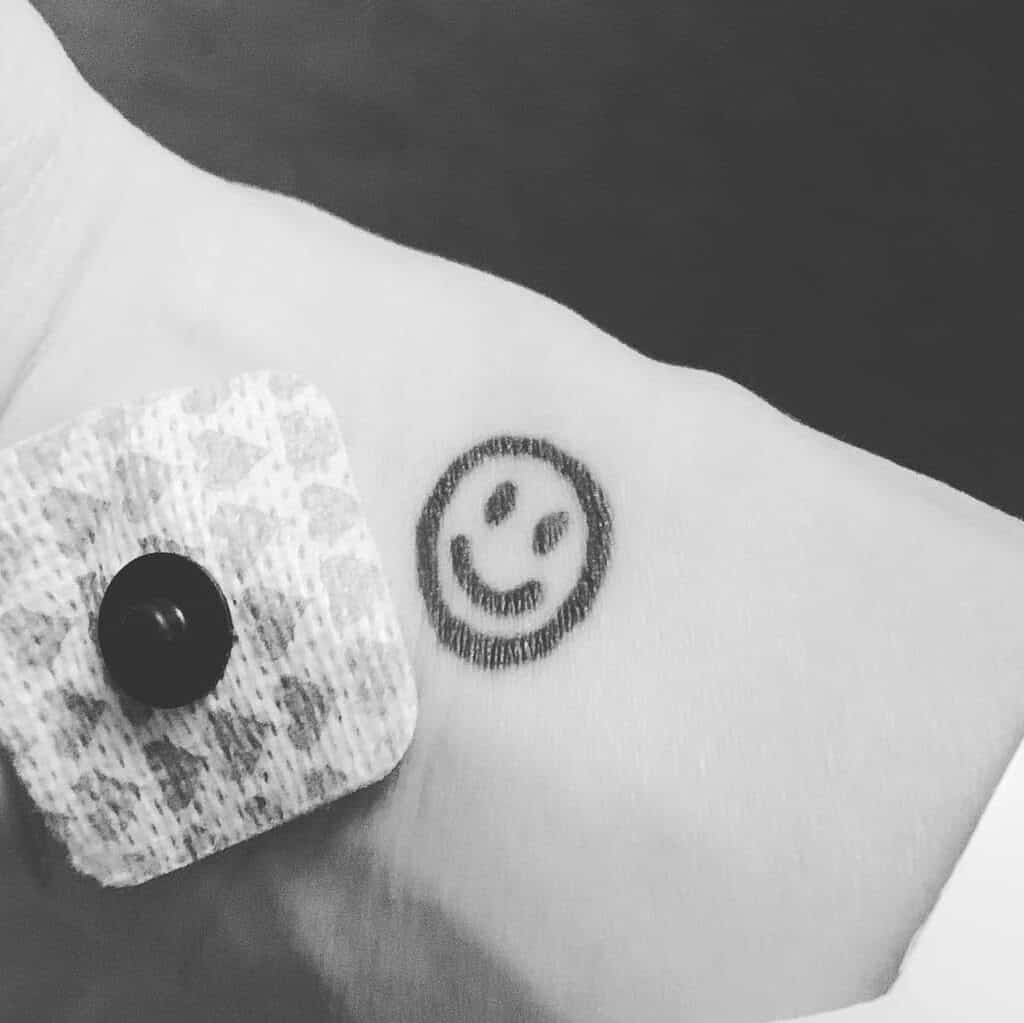 Small Black Smiley Face Wrist Tattoo | selftattoo.com