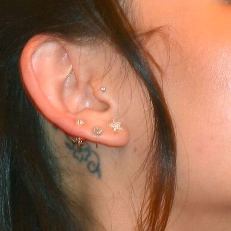 Small Minimalistic Flower Behind the Ear Tattoo | selftattoo.com