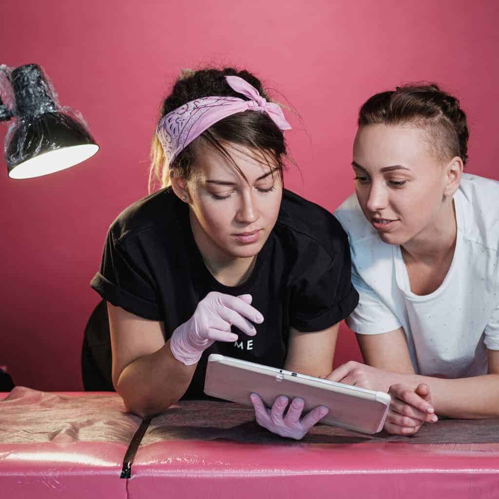 Two Women in a Tattoo Studio | selftattoo.com