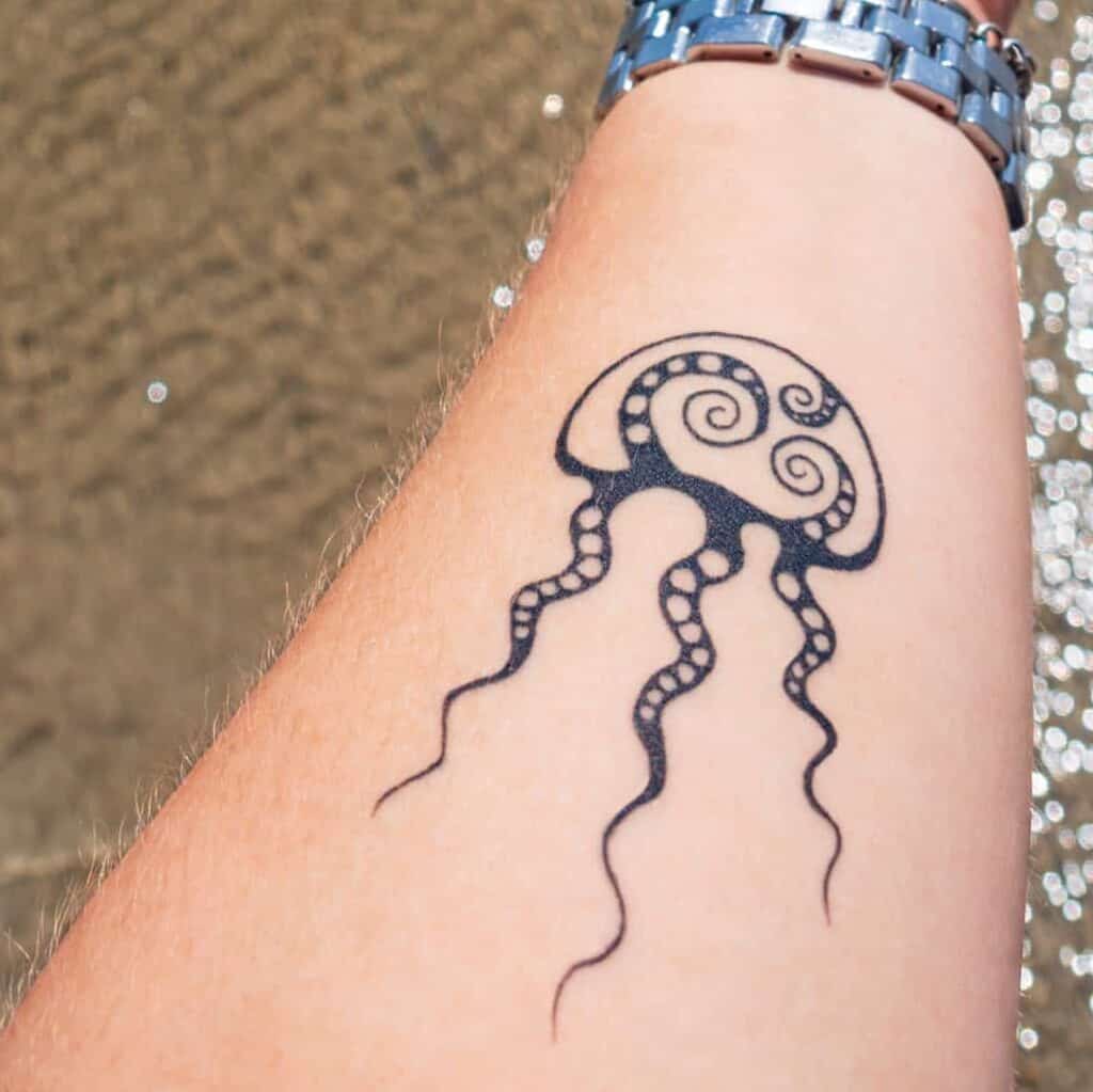 Jellyfish Forearm Tattoo with Spiral Patterns and Dots | selftattoo.com