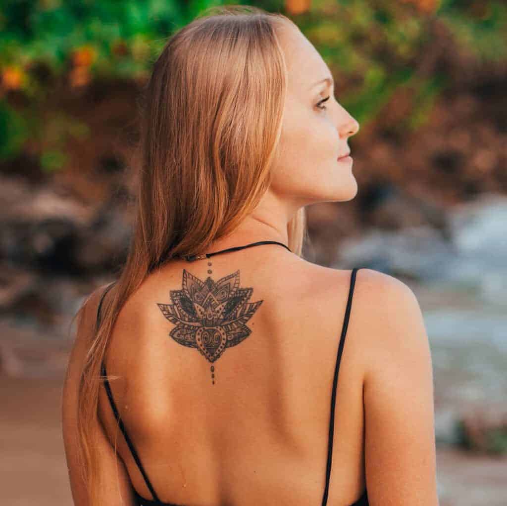 Detailed Geometric Lotus Flower Upper Back Tattoo | selftattoo.com