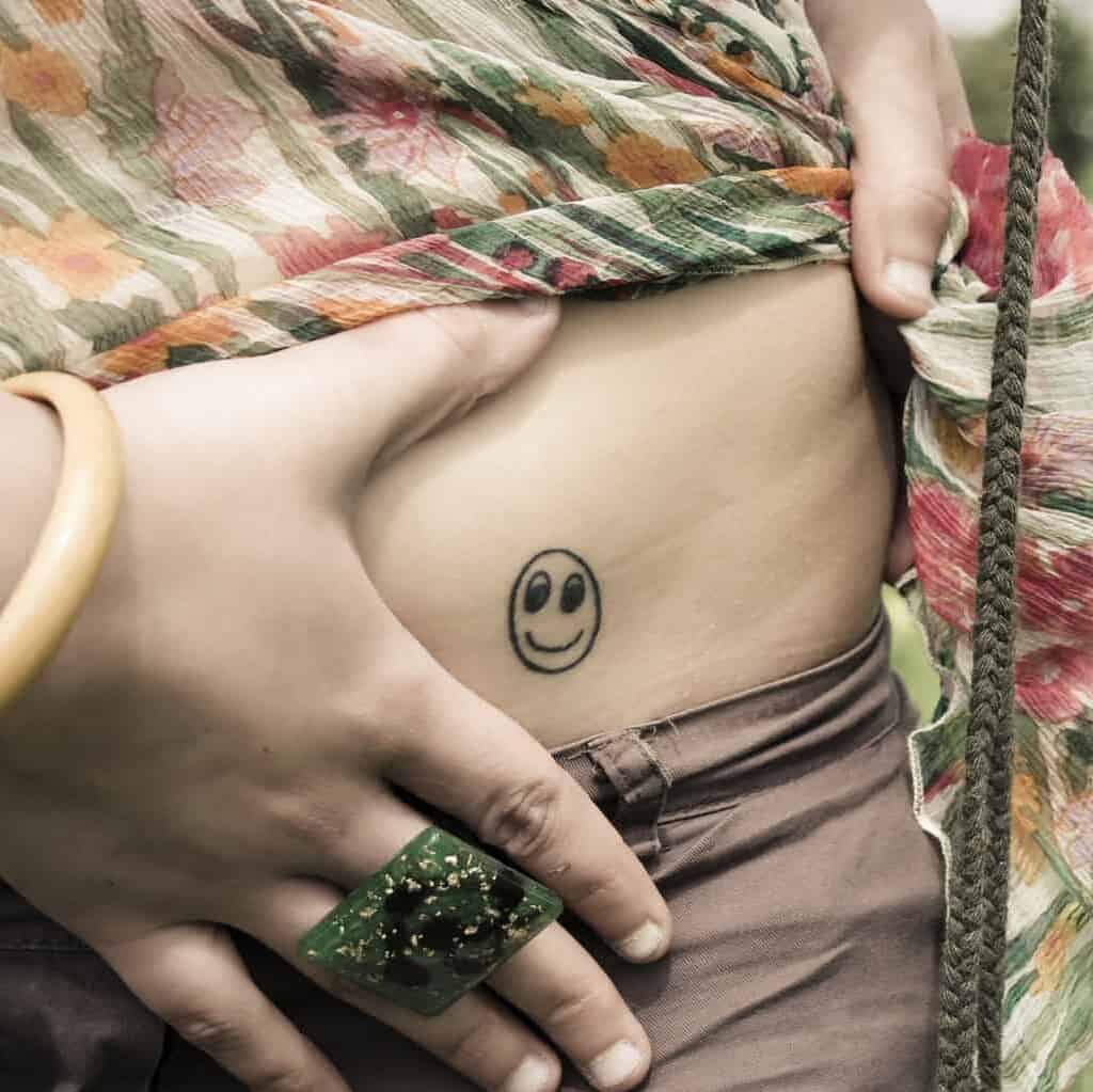 Smiley Face Hip Tattoo | selftattoo.com