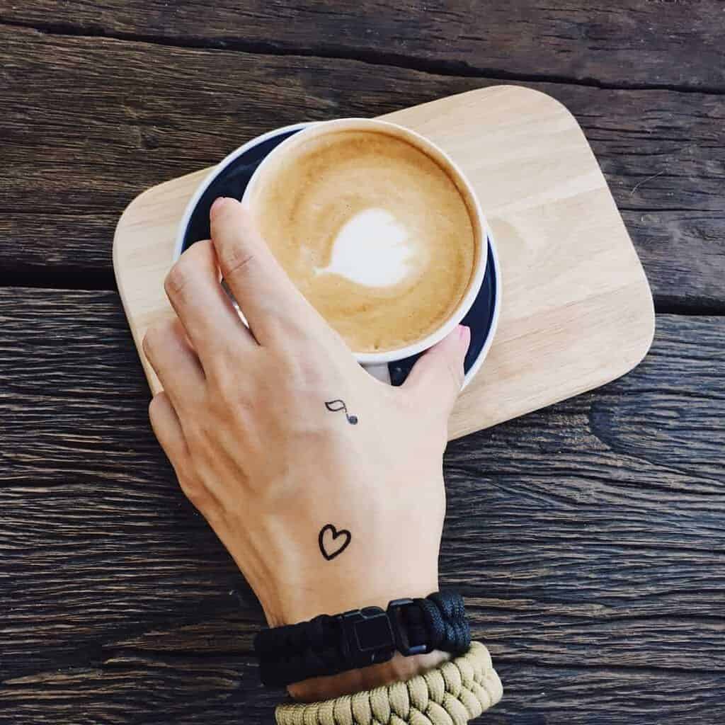 Small Music Note and Heart Back of Hand Tattoo | selftattoo.com