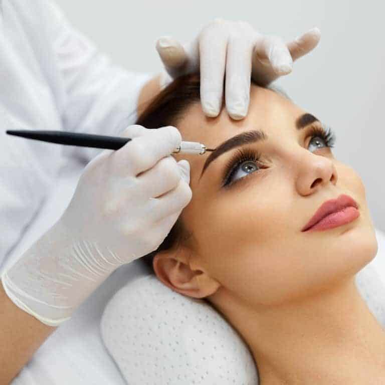 Woman undergoing Eyebrow Tattooing Procedure known as Microblading | selftattoo.com