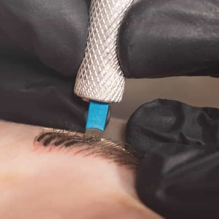 Close-up of a Microblading Tool creating Fine Eyebrow Strokes | selftattoo.com