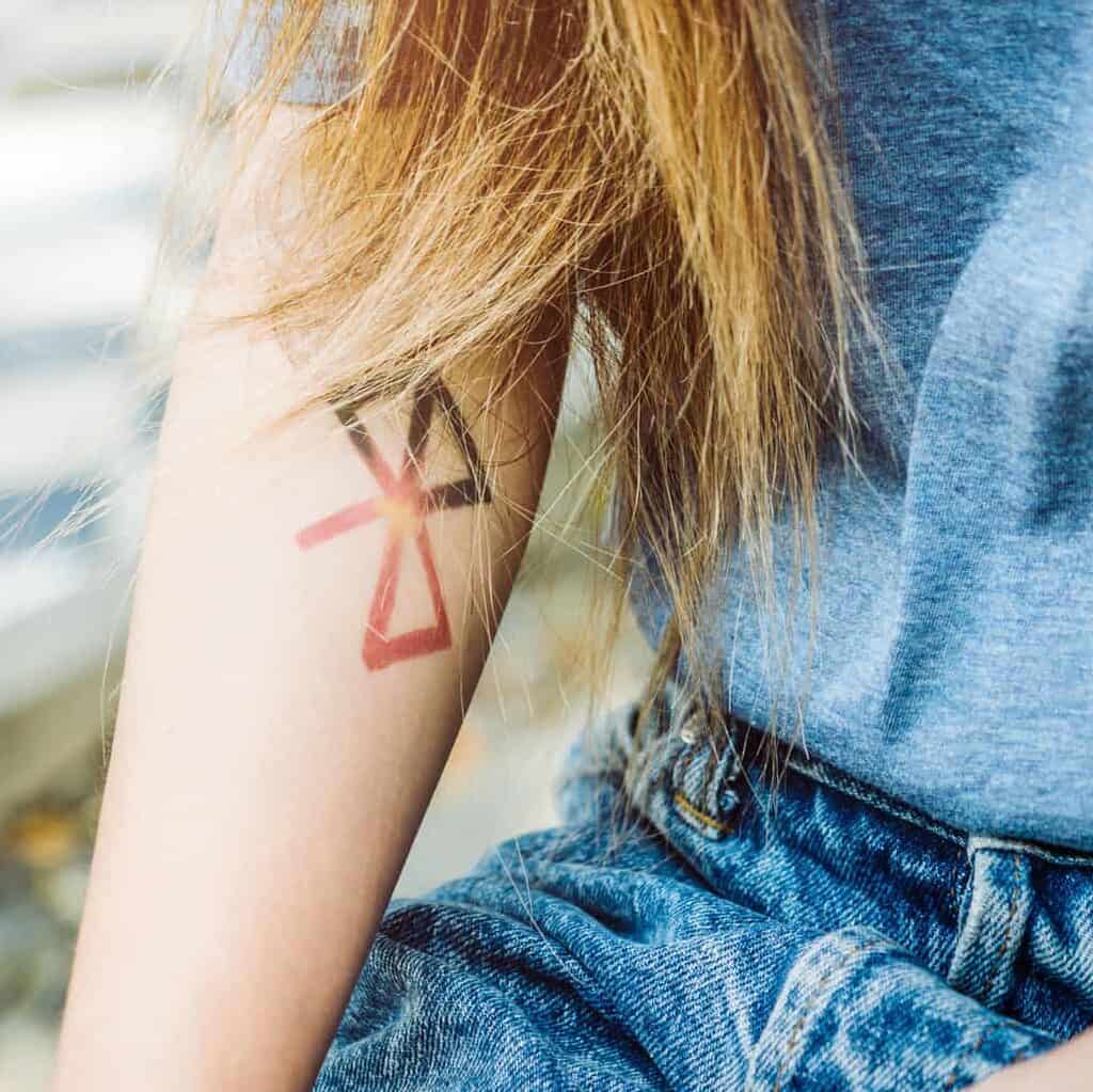 Abstract Tattoo with Intersecting Shapes on Forearm | selftattoo.com