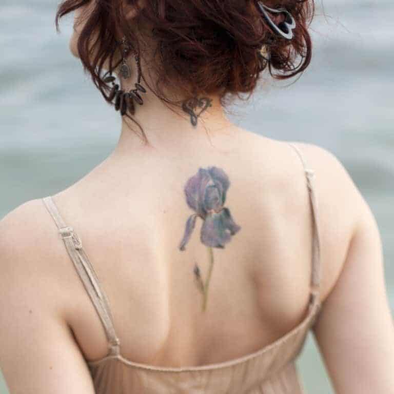 Single Realistic Purple Iris Flower with Long Green Stem Upper Back Tattoo | selftattoo.com