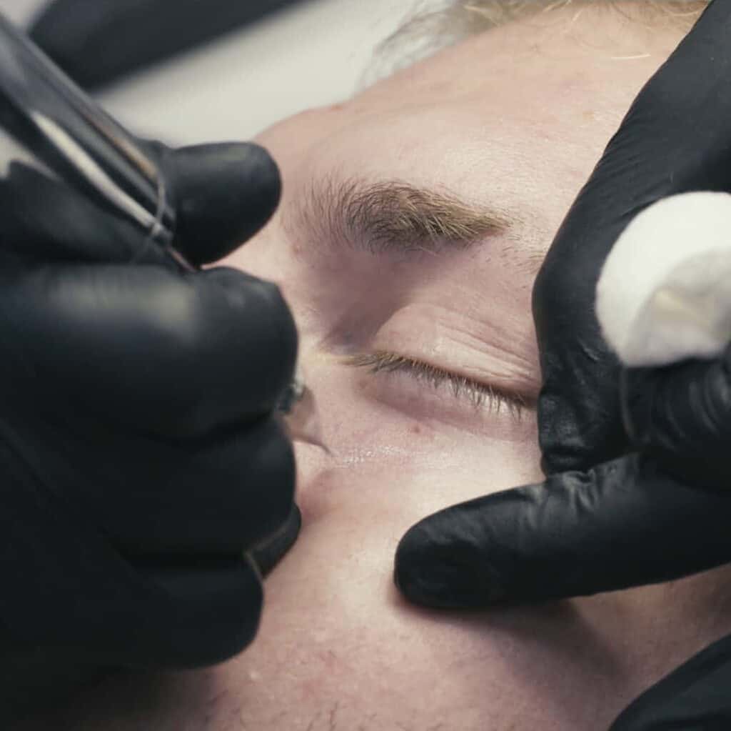 Cosmetic Practitioner using a Fine Tipped Tattoo Machine under the Eye | selftattoo.com