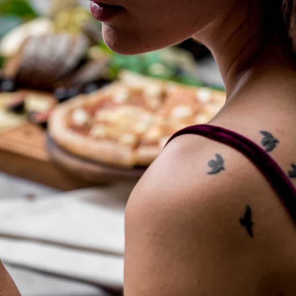 Small Scattered Black Silhouette of Birds in Flight Tattoo | selftattoo.com