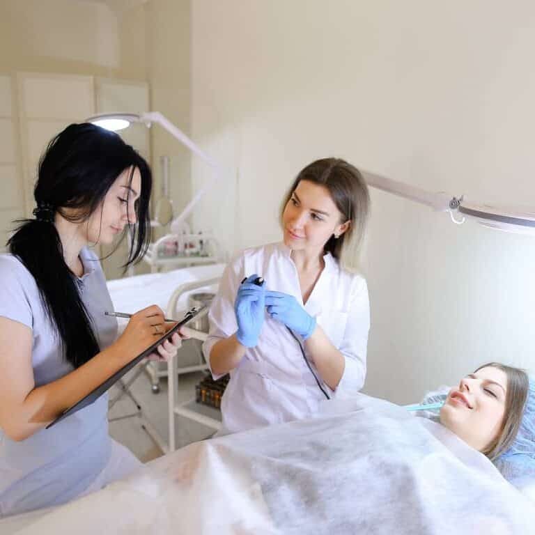 Cosmetic Clinic with Three Women engaged in a Procedure | selftattoo.com