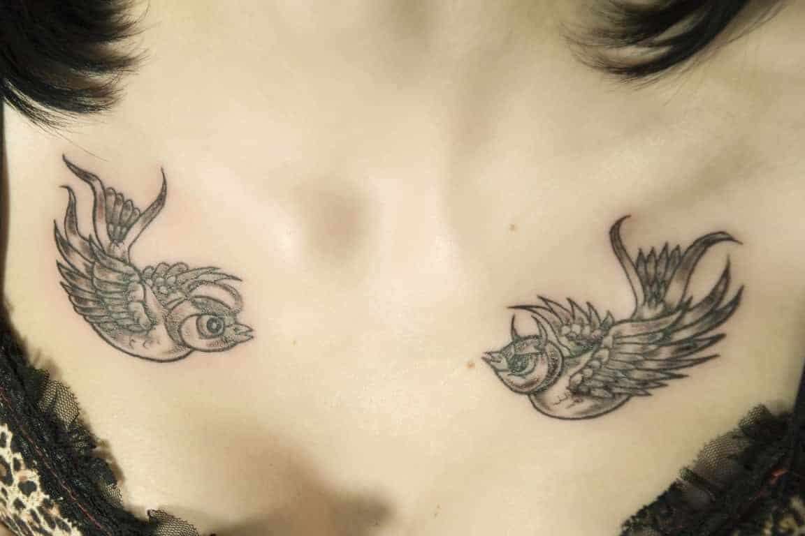 Two Black and Gray Swallows Chest Tattoo | selftattoo.com