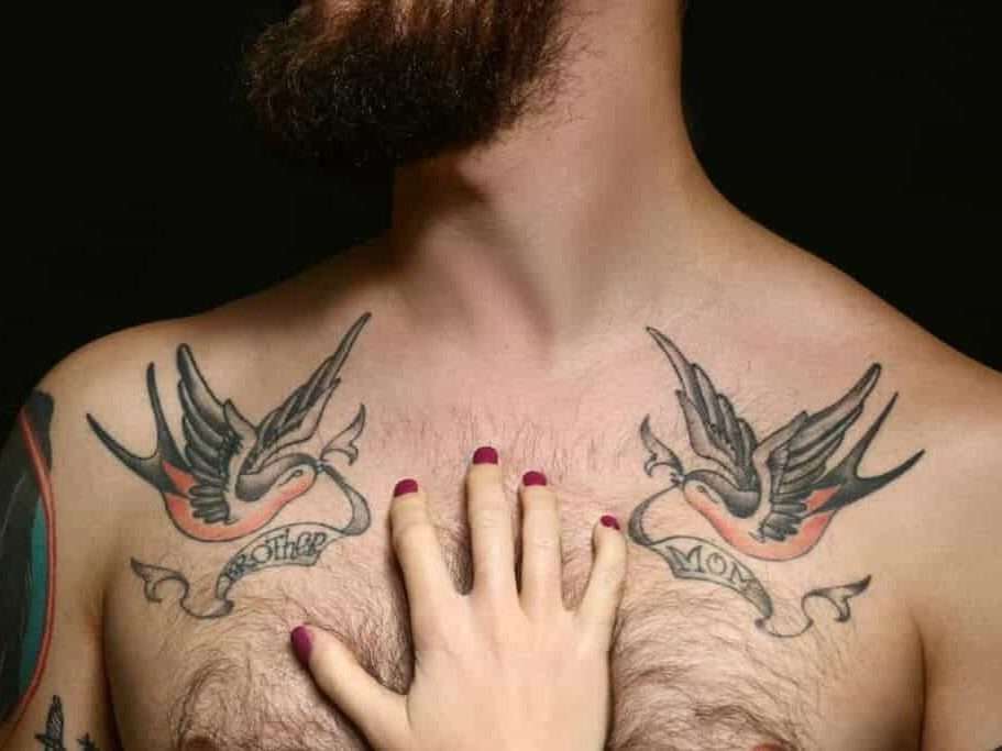 Two Swallow Chest Tattoos with Banners Reading "BROTHER" and "MOM" | selftattoo.com