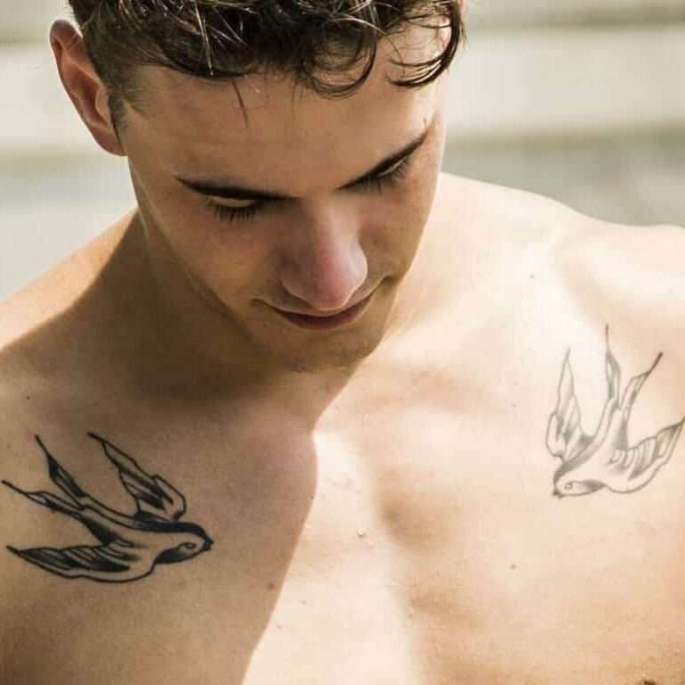 Two Swallows in Flight Chest Tattoo | selftattoo.com